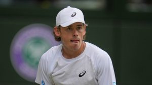 Australia's Alex de Minaur reacts as he plays Serbia's Novak Djokovic during a fourth round men's singles match at the Wimbledon Tennis Championships in London, Monday, July 7, 2025. (Kin Cheung/AP)