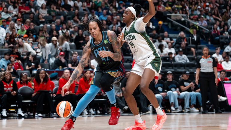 Atlanta Dream's Brittney Griner (42) drives to the basket as Seattle Storm's Dominique Malonga (14) defends during the second half of a WNBA basketball game in Vancouver, B.C., on Friday, August 15, 2025. (Ethan Cairns/CP)