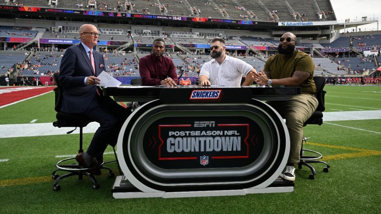 The ESPN Postseason NFL Countdown show crew members Scott Van Pelt, left, Ryan Clark, second from left, Jason Kelce and Marcus Spears, right, broadcast from the field before the NFL Pro Bowl Games between the AFC and the NFC, Sunday, Feb. 2, 2025, in Orlando, Fla. (Phelan M. Ebenhack/AP)