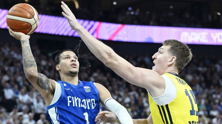 Finland's Miro Little, left, and Sweden's Mattias Markusson during the basketball FIBA EuroBasket 2025 group B match between Sweden and Finland in Tampere, Finland, Wednesday Aug. 27, 2025. (Heikki Saukkomaa/Lehtikuva via AP)