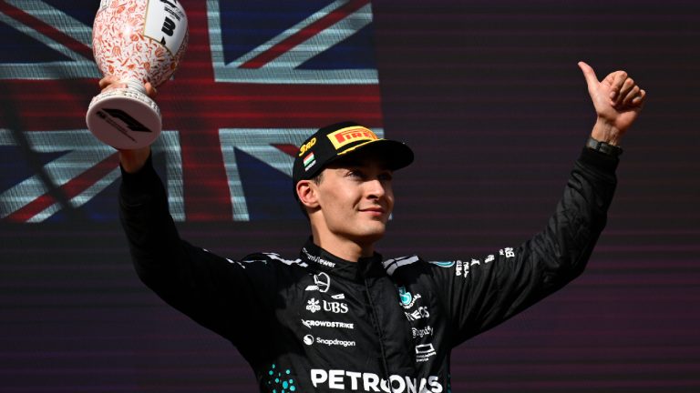 Mercedes driver George Russell of Britain celebrates his third place after the Hungarian Formula One Grand Prix race at the Hungaroring racetrack in Mogyorod, Hungary, Sunday, Aug. 3, 2025. (Denes Erdos/AP)