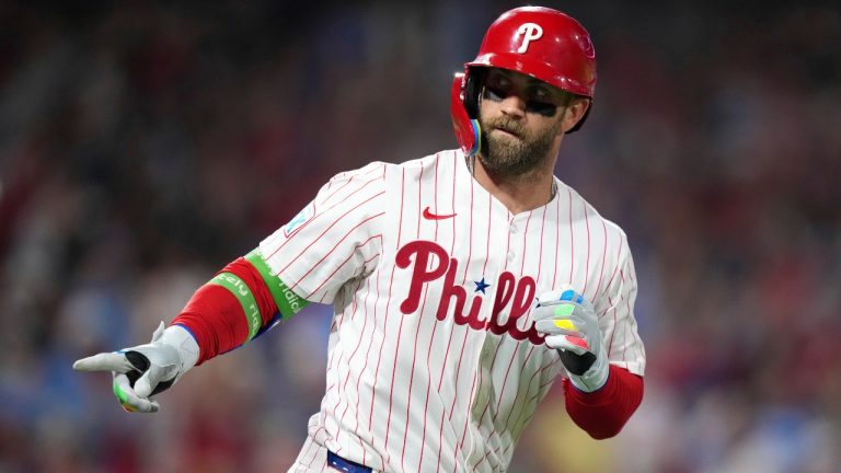 Philadelphia Phillies' Bryce Harper reacts after hitting a home run against Seattle Mariners pitcher Casey Legumina during the sixth inning of a baseball game Monday, Aug. 18, 2025, in Philadelphia. (Matt Slocum/AP)