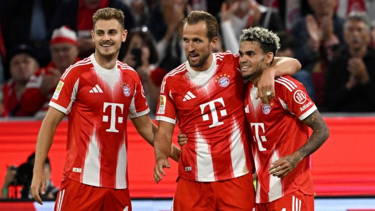 Bayern Munich's Harry Kane, centre, celebrates scoring during the Bundesliga soccer match between Bayern Munich and RB Leipzig at Allianz Arena, Munich, Germany, Friday Aug. 22, 2025. (Sven Hoppe/dpa via AP)