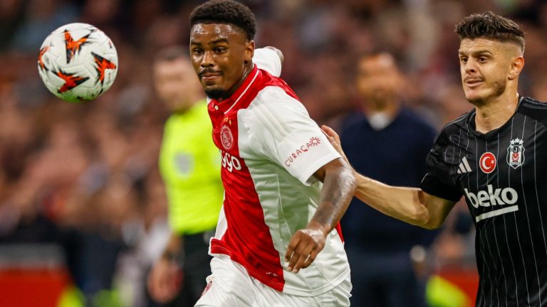 Ajax's Jorrel Hato, left, duels for the ball with Besiktas' Milot Rashica during the Europa League soccer match between Ajax and Besiktas, at the Johan Cruyff ArenA, in Amsterdam, Netherlands, Thursday, Sept. 26, 2024. (Maurice van Steen/AP)