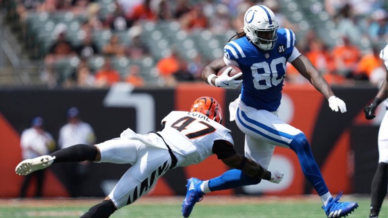 Indianapolis Colts tight end Jelani Woods (80) runs past Cincinnati Bengals safety Shaquan Loyal (47) during the second half of a pre-season NFL football game, Saturday, Aug. 23, 2025, in Cincinnati. (Jeff Dean/AP)