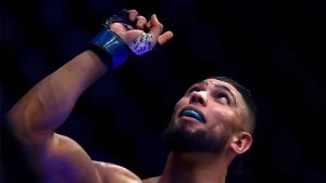 Brazil's Johnny Walker celebrates victory over United Kingdom's Paul Craig in their light heavyweight bout at the UFC 283 mixed martial arts fights. (Bruna Prado/AP)