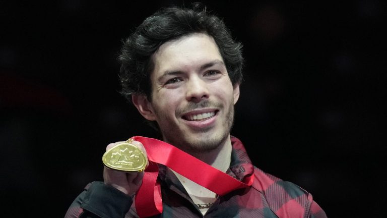 Keegan Messing displays his medal after winning gold in the men's free program at the Canadian Figure Skating Championships in Oshawa, Ont., on Saturday, January 14, 2023. (Nathan Denette/
CP)