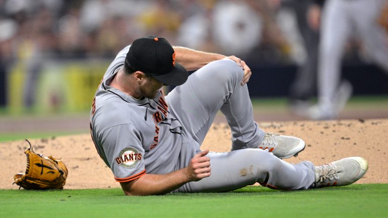 San Francisco Giants starting pitcher Landen Roupp reacts after being hit by a line drive during the third inning of a baseball game against the San Diego Padres Wednesday, Aug. 20, 2025, in San Diego. (Orlando Ramirez/AP)