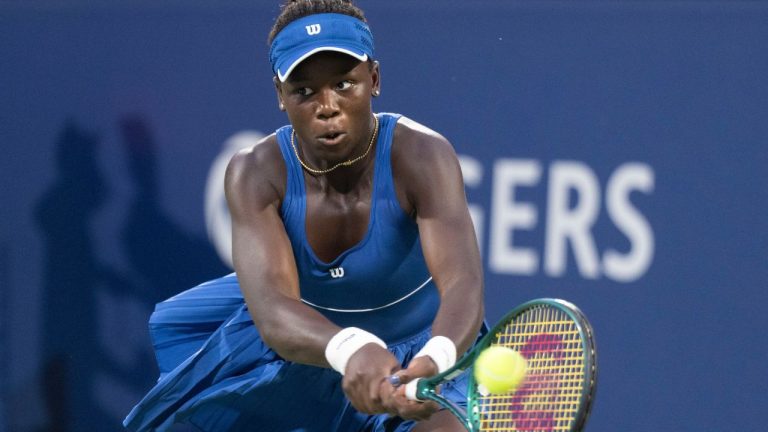 Victoria Mboko of Canada hits a return to Jessica Bouzas Maneiro of Spain during quarterfinal tennis action at the National Bank Open in Montreal, Monday, Aug. 4, 2025. (Christinne Muschi/THE CANADIAN PRESS)