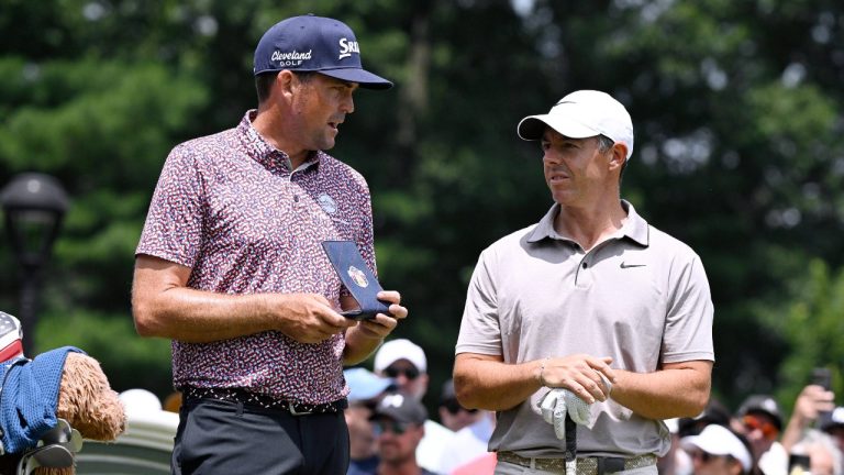 Keegan Bradley, left, talks with Rory McIlroy, right, of Northern Ireland, as they start the second round second round of the Travelers Championship golf tournament at TPC River Highlands, Friday, June 20, 2025, in Cromwell, Conn. (Jessica Hill/AP)