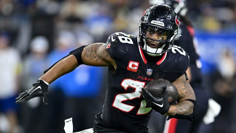 Houston Texans running back Joe Mixon (28) runs the ball during the fourth quarter against the Los Angeles Chargers of NFL wild-card playoff football game, Saturday, Jan. 11, 2025, in Houston The Texans defeated the Chargers 32-12. (Maria Lysaker/AP)