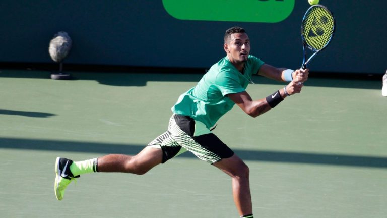Nick Kyrgios, of Australia, hits a return to Ivo Karlovic during the Miami Open tennis tournament, Monday, March 27, 2017, in Key Biscayne, Fla. (Lynne Sladky/AP)