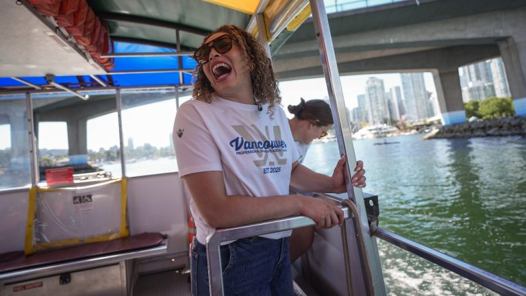 PWHL Vancouver players Sarah Nurse, front, and Kristen Campbell, back right, tour False Creek on an Aquabus water taxi, in Vancouver, B.C., Friday, Aug. 1, 2025. The Professional Women's Hockey League added expansion teams in Vancouver and Seattle for the upcoming 2025-26 season. (Darryl Dyck/CP)