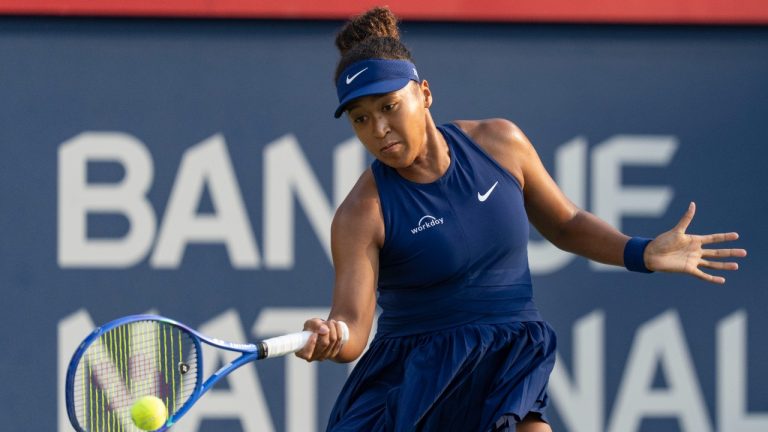 Naomi Osaka of Japan hits a return to Victoria Mboko of Canada during final tennis action at the National Bank Open in Montreal, Thursday, Aug. 7, 2025. (Christinne Muschi/CP)