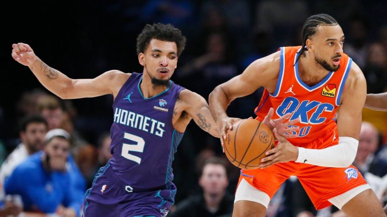 Charlotte Hornets guard James Bouknight (2) steals the ball from Oklahoma City Thunder center Olivier Sarr (30) during the second half of an NBA basketball game. (Nate Billings/AP)
