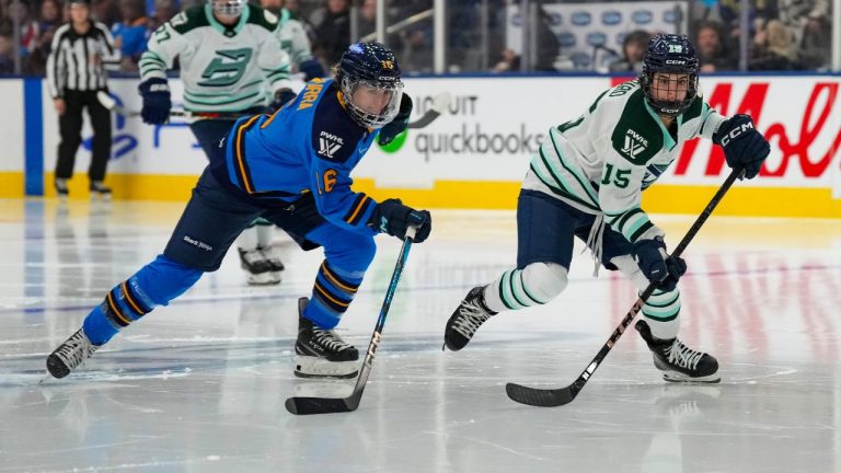 Toronto Sceptres' Hayley Scamurra (16) and Boston Fleet's Sydney Bard (15) chase after the puck during second period PWHL hockey action in Toronto on Friday Feb. 14, 2025. (Arlyn McAdorey/CP)
