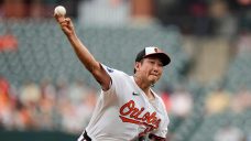 Tomoyuki Sugano earns 10th victory, Orioles outlast Mariners after rain delay