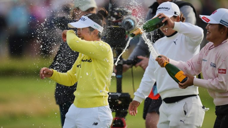 Miyu Yamashita, left, of Japan celebrates after winning the Women's British Open golf championship, at Royal Porthcawl Golf Club in Porthcawl, Wales, Sunday, Aug. 3, 2025. (Kin Cheung/AP)