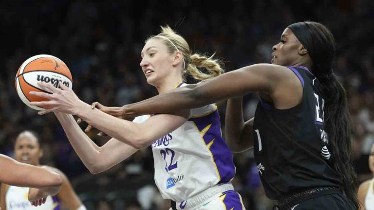 Los Angeles Sparks forward Cameron Brink, left, grabs a rebound in front of Phoenix Mercury center Kalani Brown, right, during the first half of a WNBA basketball game Tuesday, Sept. 9, 2025, in Phoenix. (Ross D. Franklin/AP)