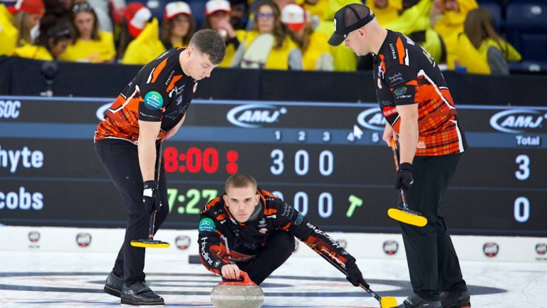 Scotland’s Team Ross Whyte sliding out with Euan Kyle (Left) and Craig Waddell (Right) getting ready to sweep his shot in the fourth end vs. Canada’s Team Brad Jacobs at the AMJ Masters, Thursday Sept. 25, 2025, in London, Ont. (Anil Mungal/TCG)