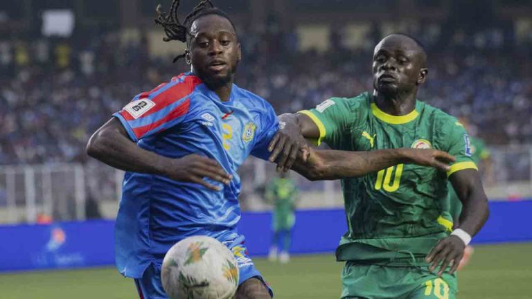 DR Congo's Aaron Wan-Bissaka, Left, challenge for the ball with Senegal's Sadio Mane, Right, during a World Cup 2026 group B qualifying soccer match between DR Congo and Senegal at the Martyrs' Stadium in Kinshasa, Democratic Republic of Congo, Tuesday, Sept. 9, 2025. (Samy Ntumba Shambuyi/AP)