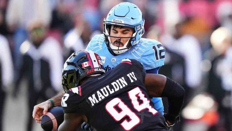 Ottawa Redblacks defensive end Lorenzo Mauldin IV (94) sacks Toronto Argonauts quarterback Chad Kelly (12) causing a fumble during first half Eastern Conference semifinal CFL football action in Toronto on Saturday, November 2, 2024. (Nathan Denette/CP)