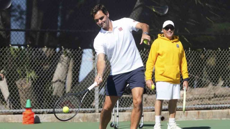 Co-creator of the Laver Cup Roger Federer hits tennis balls to local youth tennis players during a court unveiling at John McLaren Park Tennis Courts before the Laver Cup tennis matches in San Francisco, Tuesday, Sept. 16, 2025. (Jeff Chiu/AP)