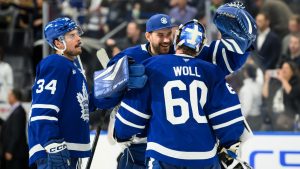 Toronto Maple Leafs' Auston Matthews (34), goaltender Anthony Stolarz (41) and goaltender Joseph Woll (60) celebrate after defeating the Colorado Avalanche in an NHL hockey game in Toronto on Wednesday, March 19, 2025. (Christopher Katsarov/CP)