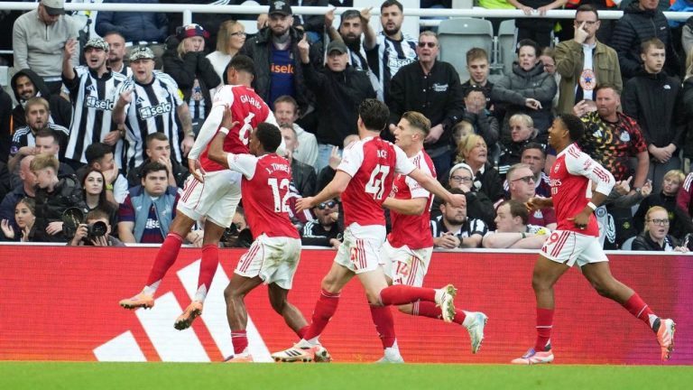Arsenal's Gabriel, left, celebrates with teammates after scoring his side's second goal during the English Premier League match between Newcastle and Arsenal at St James' Park, Newcastle upon Tyne, Sunday, Sept. 28, 2025. (AP/Jon Super)