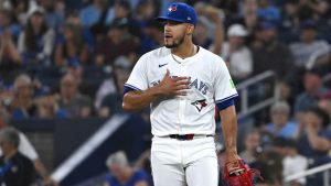 Toronto Blue Jays starting pitcher Jose Berrios (17) reacts to making the final out of the first inning against the Texas Rangers in first inning MLB baseball action in Toronto, on Sunday, Aug. 17, 2025. (Jon Blacker/CP)