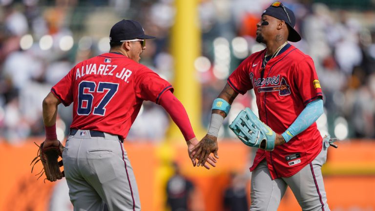 Atlanta Braves right fielder Ronald Acuna Jr., right, and third baseman Nacho Alvarez Jr. celebrate after the team's win in a baseball game against the Detroit Tigers, Saturday, Sept. 20, 2025, in Detroit. (Ryan Sun/AP)
