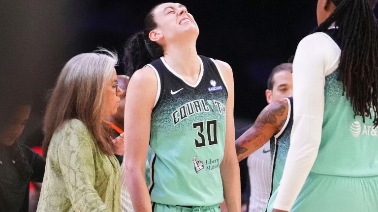 New York Liberty forward Breanna Stewart (30) grimaces after getting fouled by the Phoenix Mercury during the second half of Game 1 during the first round of the WNBA basketball playoffs Sunday, Sept. 14, 2025, in Phoenix. (Darryl Webb/AP)