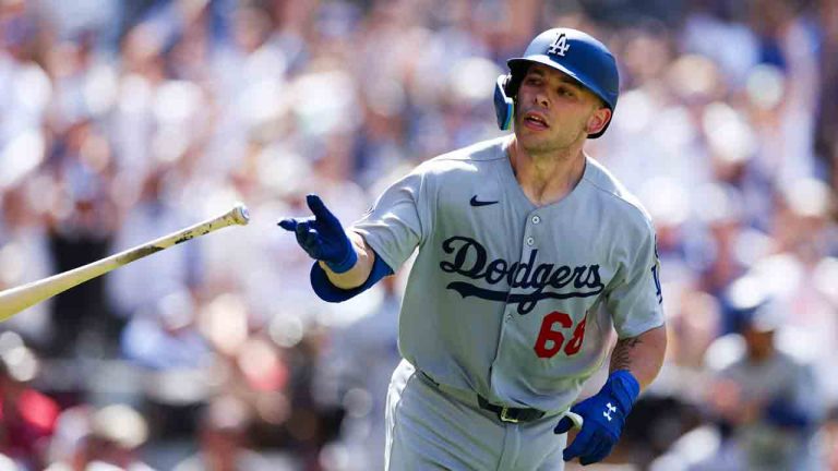 Los Angeles Dodgers' Dalton Rushing tosses his bat after hitting a three-run home run against the San Diego Padres in the seventh inning of a baseball game Sunday, Aug. 24, 2025, in San Diego. (Derrick Tuskan/AP)