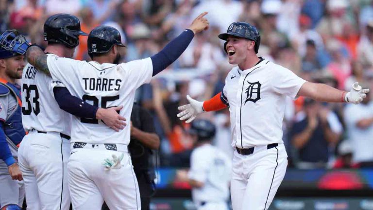 Detroit Tigers designated hitter Kerry Carpenter, right, celebrates with Colt Keith, left, and Gleyber Torres, after hitting a three-run home run during the seventh inning of a baseball game against the New York Mets, Wednesday, Sept. 3, 2025, in Detroit. (Ryan Sun/AP)