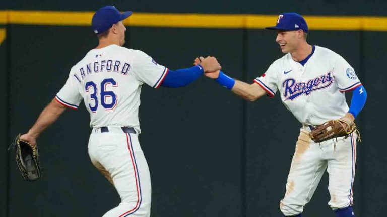 Texas Rangers outfielders Wyatt Langford (36) and Michael Helman react after the final out of a baseball game against the Milwaukee Brewers Tuesday, Sept. 9, 2025, in Arlington, Texas. (Julio Cortez/AP)