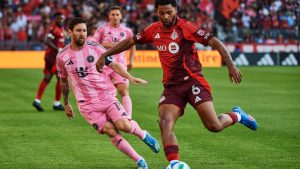 Inter Miami's Lionel Messi battles for the ball with Toronto FC's Kosi Thompson during MLS action in Toronto, on Saturday, Sept. 27, 2025. (Sammy Kogan/CP)