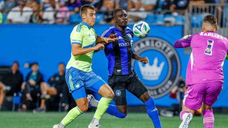CF Montreal forward Prince Owusu, center, moves the ball against Charlotte FC midfielder Andrew Privett, left, and goalkeeper Kristijan Kahlina (1) during the first half of an MLS soccer match in Charlotte, N.C., Saturday, Sept. 27, 2025. (Nell Redmond/AP)