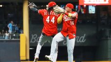 Reds on cusp of playoff berth after beating Brewers