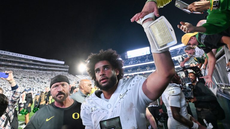 Oregon quarterback Dante Moore celebrates a second overtime win over Penn State during their NCAA college game, Saturday, Sept. 27, 2025, in State College, Pa. (Barry Reeger/AP)