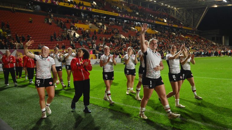 Canada's team players celebrate after winning the Women's Rugby World Cup 2025 semifinal match between New Zealand and Canada in Bristol, England, Friday, Sept. 19, 2025. (Anthony Upton/AP)