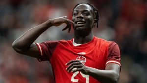 Canada's Promise David celebrates his goal against Honduras during the second half of a CONCACAF Gold Cup soccer match in Vancouver, on Tuesday, June 17, 2025. (Ethan Cairns/CP)