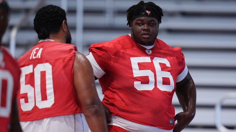 Tampa Bay Buccaneers defensive tackle Desmond Watson (56) talks to defensive tackle Vita Vea (50) during an NFL football minicamp practice Tuesday, June 10, 2025, in Tampa, Fla. (Chris O'Meara/AP)