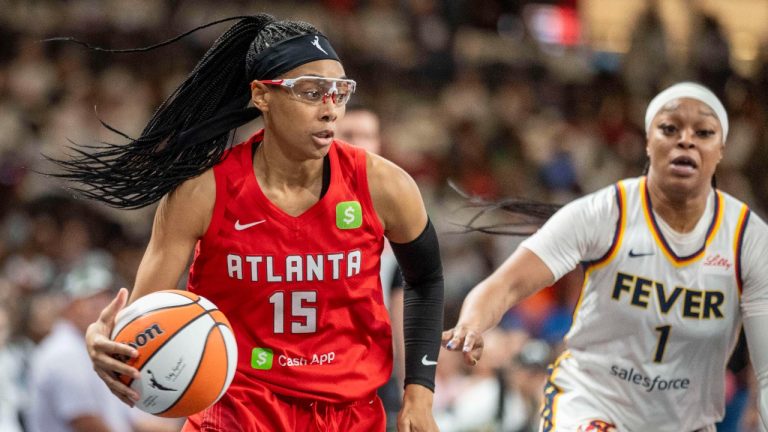 Atlanta Dream guard Allisha Gray, left, drives the ball during the first half of Game 1 against the Indiana Fever in the first round of the WNBA basketball playoffs Sunday, Sept. 14, 2025, in Atlanta. (AP Photo/Erik Rank)
