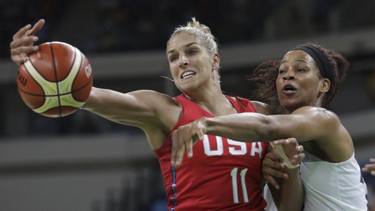 United States' Elena Delle Donne (11) and France's Marielle Amant, right, reaching out for the ball during a women's semifinal round basketball game at the 2016 Summer Olympics in Rio de Janeiro, Brazil. (Eric Gay/AP)