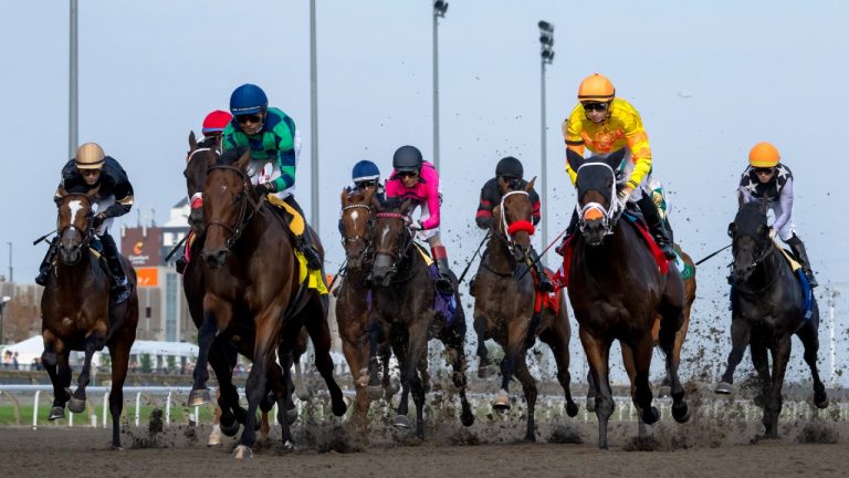Jockey Pietro Moran (second from right) rides Mansetti on his way to winning the King's Plate horse race, in Toronto, Saturday, Aug. 16, 2025. (Frank Gunn/CP)