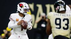 Murray throws two TD passes, Cardinals hold on in Saints coach Moore’s debut