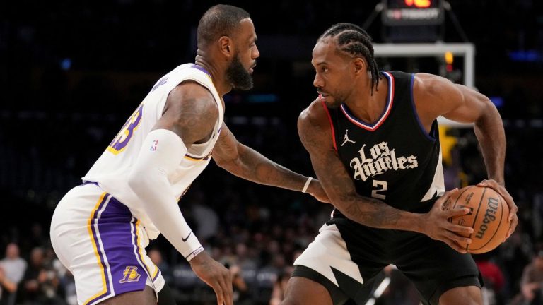 Los Angeles Lakers forward LeBron James, left, covers Los Angeles Clippers forward Kawhi Leonard (2) during the second half of an NBA basketball game in Los Angeles, Sunday, Jan. 7, 2024. (Eric Thayer/AP)