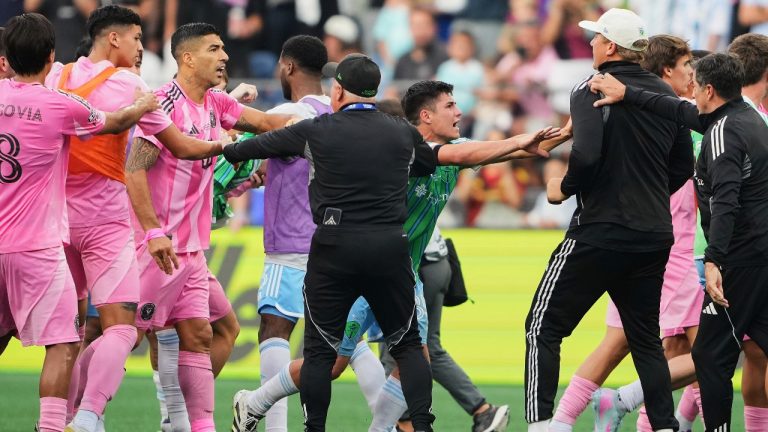 Inter Miami forward Luis Suárez, third from left, is separated from Seattle Sounders players and staff as Sounders midfielder Kalani Kossa-Rienzi, center right facing, holds a staff member back during a fight after the Sounders won the Leagues Cup final soccer match Sunday, Aug. 31, 2025, in Seattle. (AP Photo/Lindsey Wasson)