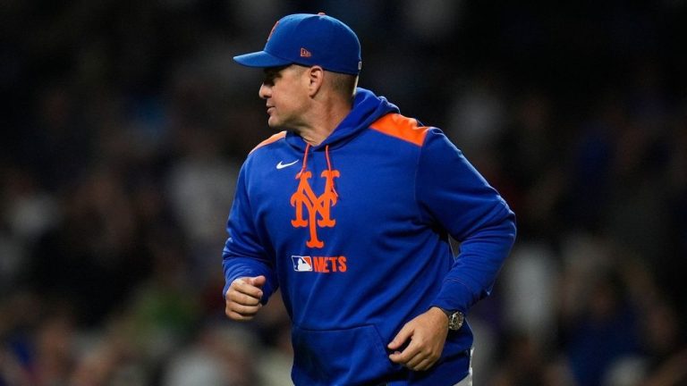 New York Mets manager Carlos Mendoza (64) returns to the dugout after making a pitching change during the second inning of a baseball game against the Chicago Cubs, Tuesday, Sept. 23, 2025, in Chicago. (Erin Hooley/AP)
