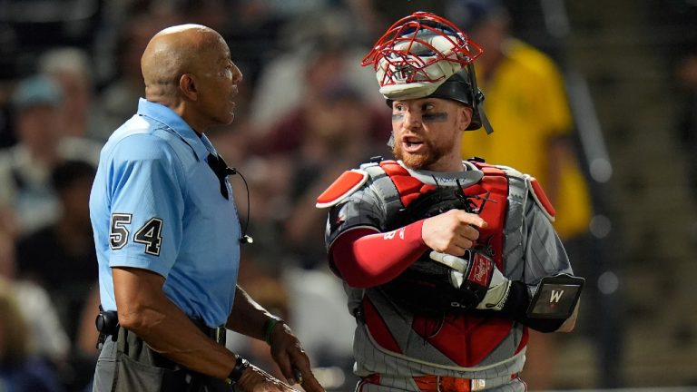 Minnesota Twins catcher Christian Vázquez talks to home plate umpire CB Bucknor, left, after a challenge on a running play by Tampa Bay Rays' Kameron Misner during the sixth inning of a baseball game Monday, May 26, 2025, in Tampa, Fla. (Chris O'Meara/AP)